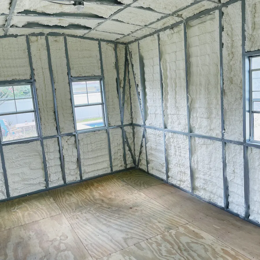 Closed-cell spray foam insulation applied to wall cavities in a residential project in Grand Island